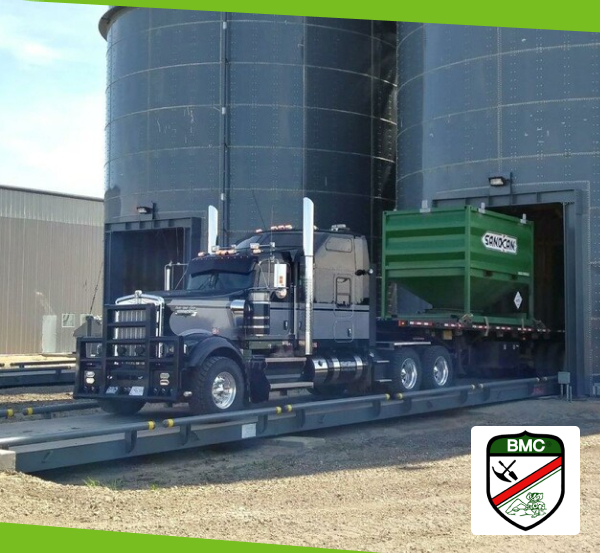 truck backing into a silo