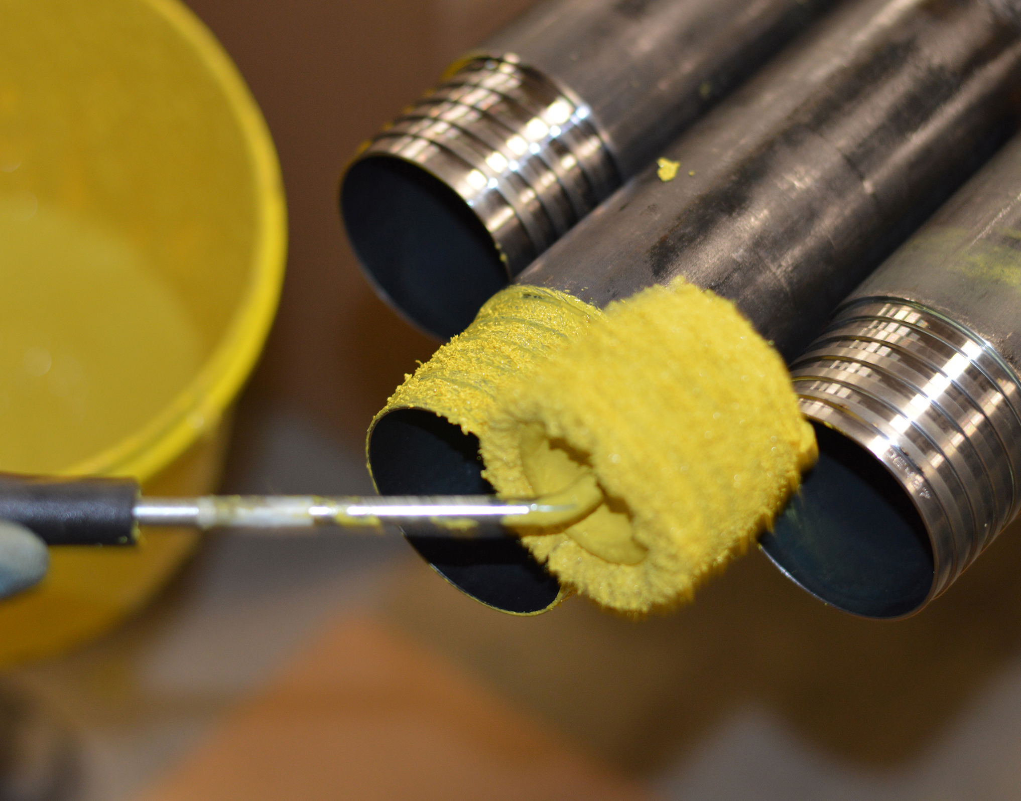 Rolling thread shield onto Drillers Edge rod threads.